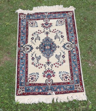 A white and blue ground Persian rug with central medallion within a 4 row border 108cm x 62cm 