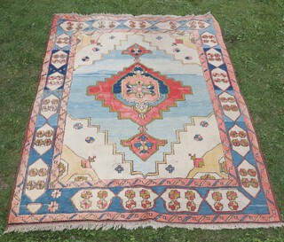 A white, orange and blue Caucasian style carpet with central medallion 285cm x 199cm 