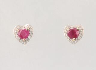 A pair of 9ct yellow gold ruby and diamond heart shaped ear studs, the rubies each 0.15ct, the diamonds 0.10ct, 1.3 grams 