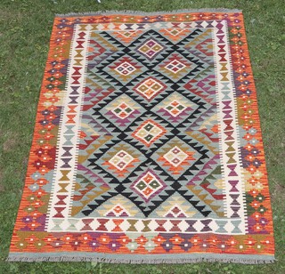 A black, green and orange ground Maimana Kilim with overall diamond design 178cm x 118cm 