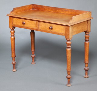 A Victorian bleached mahogany dressing table with 3/4 gallery, fitted 2 short drawers, raised on turned supports 83cm h x 97cm w x 47cm d 