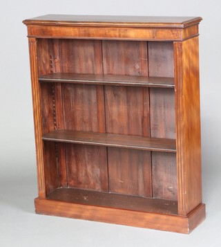 A Victorian mahogany and pine open bookcase with fluted columns to the sides, raised on a platform base 107cm h x 91cm w x 26cm d 