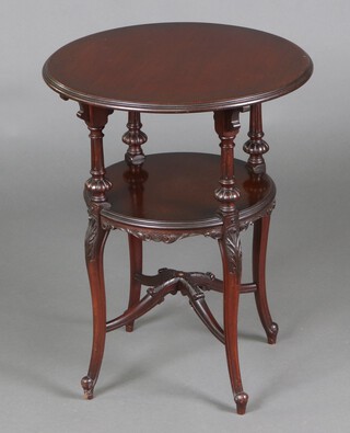 An Edwardian circular carved mahogany 2 tier occasional table raised on cabriole supports with X framed stretcher 65cm h x 51cm diam. 