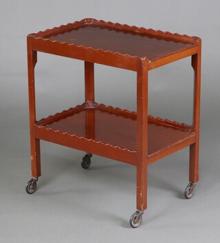 An Edwardian rectangular mahogany 2 tier tea trolley with wavy border 71cm h x 61cm w x 40cm d 