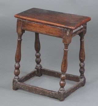 A 17th Century and later rectangular oak joined stool (the top is a later replacement) raised on turned and block supports with box framed stretcher 53cm h x 46cm w x 24cm d 