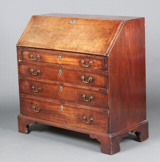 A Georgian mahogany bureau with fall front revealing a well fitted interior, above 4 long graduated drawers with brass swan neck drop handles 106cm x 107cm x 50cm d 