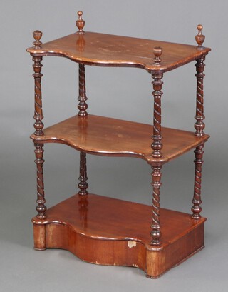 A Victorian walnut 3 tier what-not of serpentine outline, raised on spiral turned columns, the base fitted a drawer 82cm h x 56cm w x 37cm d 