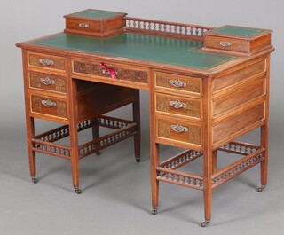 Wilkinson, 8 Old Bond Street, a Victorian painted rosewood writing table, the raised back with bobbin turning, fitted 2 drawers and with tooled green leather writing surface, fitted 1 long and 6 short drawers with pierced silvered handles, raised on square supports with ceramic castors, 84cm h x 117cm w x 60cm d