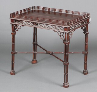 A 19th Century rectangular Chippendale style mahogany silver table with pierced gallery and gothic pierced apron, raised on 4 turned column supports with X framed stretcher 73cm h x 75cm w x 48cm d 