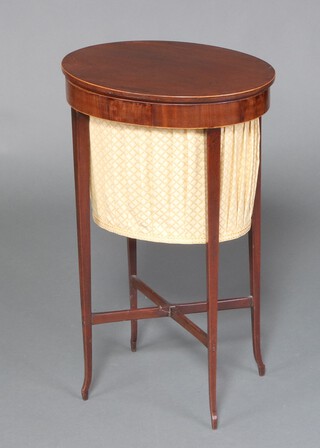 An Edwardian oval inlaid mahogany work box with hinged lid and deep fabric basket, raised on square tapered supports with X framed stretcher 72cm h x 43cm w x 34cm d 