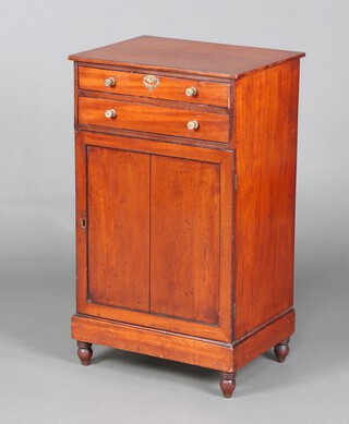 A 19th Century rectangular mahogany cabinet fitted 2 short drawers above cupboard enclosed by panelled doors 85cm h x 50cm w x 37cm d 