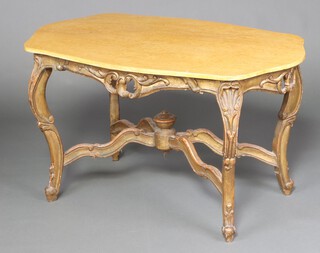 A 19th Century French carved gilt wood centre table of serpentine outline and with marble effect top, raised on cabriole supports with X framed stretcher, surmounted by a lidded urn, 67cm h x 116cm w x 71cm d 