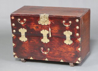 A 19th Century Korean elm and brass mounted blanket chest with fall front 54cm h x 73cm w 37cm cm d together with a Tong-in certificate of authenticity 