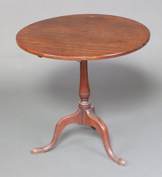 A Georgian circular mahogany snap top tea table, raised on a turned column and tripod base 71cm h x 74cm diam. 