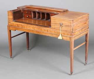 An 18th Century mahogany square piano converted for use as a writing table, the hinged lid revealing pigeon holes and 4 drawers, having a sliding writing slide, raised on square tapered supports 89cm h x 130cm w x 53cm d 