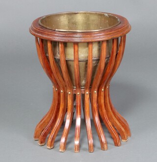 An Edwardian circular inlaid mahogany jardiniere of waisted form with brass liner 44cm x 37cm 