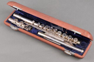 An unmarked silver plated 3 piece flute 