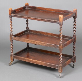A 1930's rectangular oak 3 tier tea trolley with spiral turned columns 78cm x 76cm x 40cm 