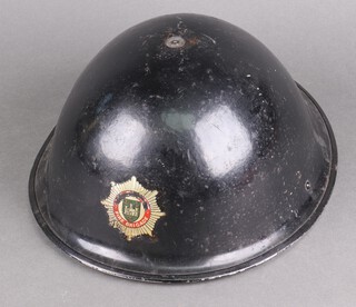 A fireman's metal helmet 