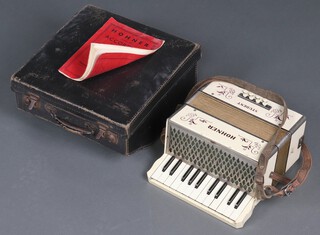 A Hohner student accordion with 8 buttons and carrying case  