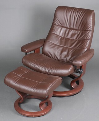 A Stressless armchair upholstered in brown leather 98cm h x 82cm w x 64cm d together with a matching footstool 