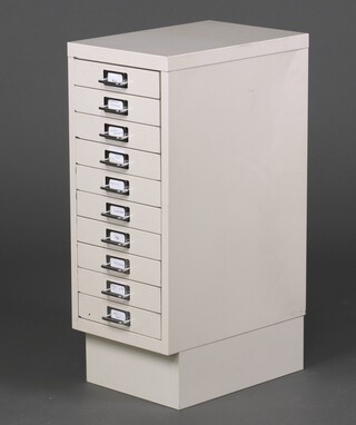 A white painted metal filing cabinet of 10 shallow drawers 71cm h x 28cm w x 41cm d 