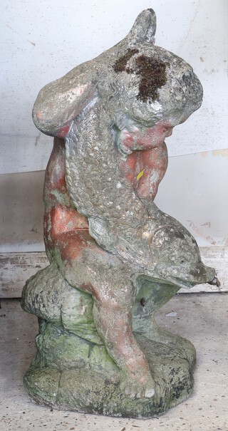 A well weathered concrete garden fountain in the form of a cherub with dolphin 60cm h x 30cm 