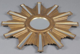 An Art Deco style circular sunburst wall mirror contained in a gilt  metal frame 80cm 