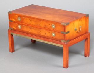 A yew military style rectangular chest of 2 drawers, raised on square tapered supports 49cm h x 86cm w x 46cm d 