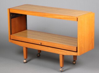 A mid-century rectangular teak and woodgrain effect trolley/table 76cm h x 113cm w x 38cm d 