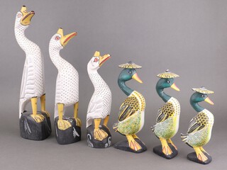 Six carved wooden figures of standing geese, tallest 41cm, smallest 20cm 