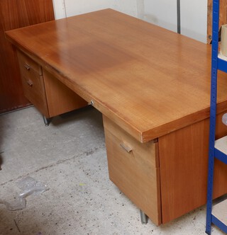 A mid-century teak pedestal desk fitted brushing slides and 4 drawers 74cm h x 183cm w x 91cm d 