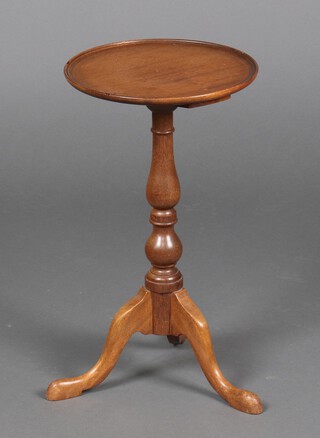 A Georgian style circular mahogany wine table on a pillar and tripod base 52cm h x 30cm diam. 