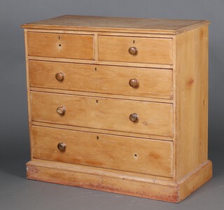 A 19th Century pine chest of 2 short and 3 long drawers with turned handles, raised on a platform base 101cm h x 106cm w x 53cm d (1 handle missing)