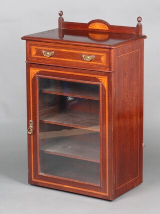 An Edwardian inlaid mahogany music cabinet with raised back fitted a drawer, enclosed by a glazed panelled door on a platform base 97cm h x 56cm w x 34cm d (base is loose) 