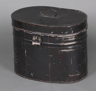 An oval pressed metal hat tin 32cm h x 42cm w x 28cm d 
