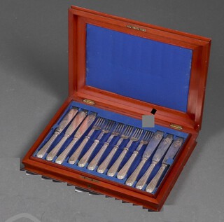 A set of 12 Victorian silver plated fish knives and forks contained in a walnut canteen box 