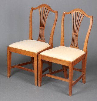A pair of 19th Century bleached oak Hepplewhite style dining chairs with upholstered drop in seats, on square supports 95cm h x 48cm w x 42cm d (signs of old but treated worm)