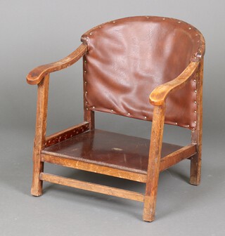 A 1930's beech framed tub back chair upholstered in brown material, on square supports 60cm h x 58cm w x 51cm d 