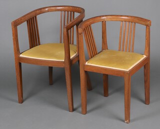 A 1920's oak tub and stick back chair with upholstered seat on square supports 79cm h, together with a similar corner chair 