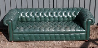 A 4 seat Chesterfield upholstered in green buttoned leather 69cm h x 229cm w x 85cm d (seat 157cm x 50cm, some tears to leather in places)