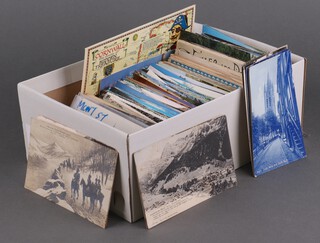 A quantity of black and white and coloured postcards, contained in a shoe box 