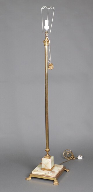 An onyx and gilt metal standard lamp raised on a square base 136cm h (1 foot loose) 