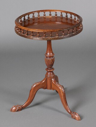 A Georgian style circular galleried wine table on a turned column and tripod base 63cm h x 44cm diam. 