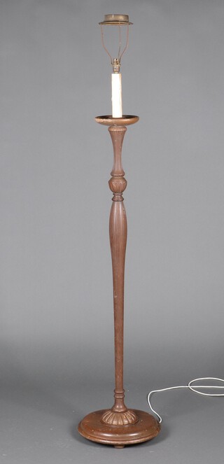 A turned and reeded beech standard lamp on a circular base 149cm h 