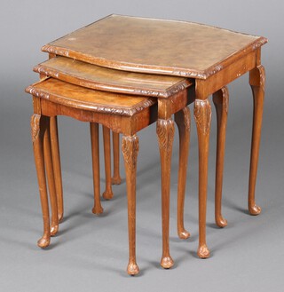A nest of 3 1950's walnut Queen Anne style coffee tables of serpentine outline 56cm h x 53cm w x 46cm d 