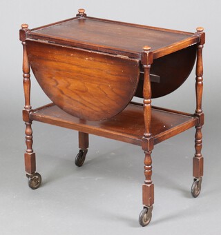 An oak oval drop flap 2 tier tea trolley 73cm h x 66cm w x 41cm d 