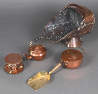 A Victorian copper helmet shaped coal scuttle, ditto kettle and stand and a twin handled bowl 