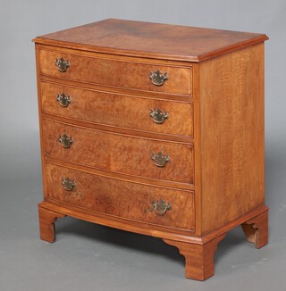 A Queen Anne style walnut bow front chest of 4 drawers, raised on bracket feet 84cm h x 80cm w x 50cm d 