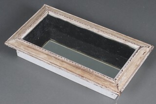 A rectangular mirrored table top display cabinet in a white limed case 10cm h x 65cm w x 36cm d 